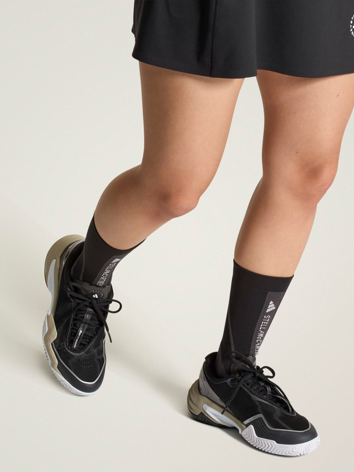 Core Black, Almond Milk and Metallic Silver Barricade Tennis Shoes